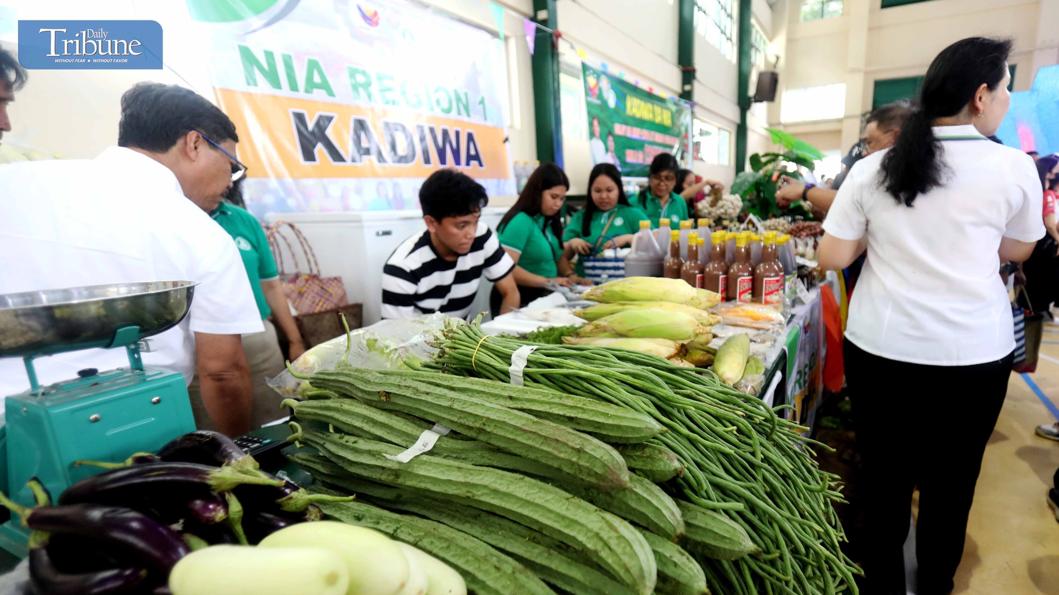 (FILES) Kadiwa stall owners from different regions are selling various products at the Kadiwa Market during the launch of "Murang Bigas sa NIA @29 pesos" at the NIA Headquarters in Quezon City on Thursday, 8 August 2024. It's a project that supports President Ferdinand Marcos Jr.'s goal of ensuring food security and boosting the country's economy.